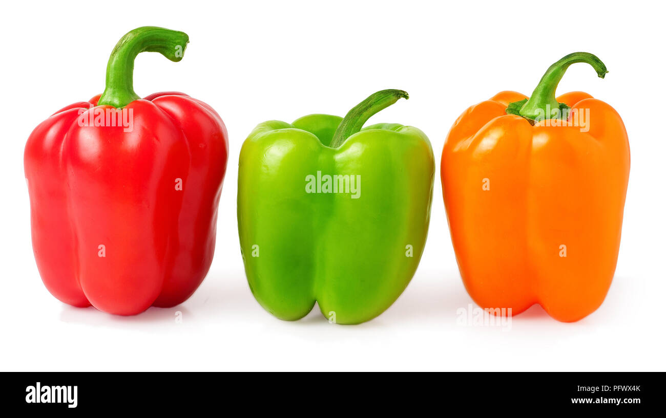 red, green and orange bell peppers on a white background Stock Photo ...