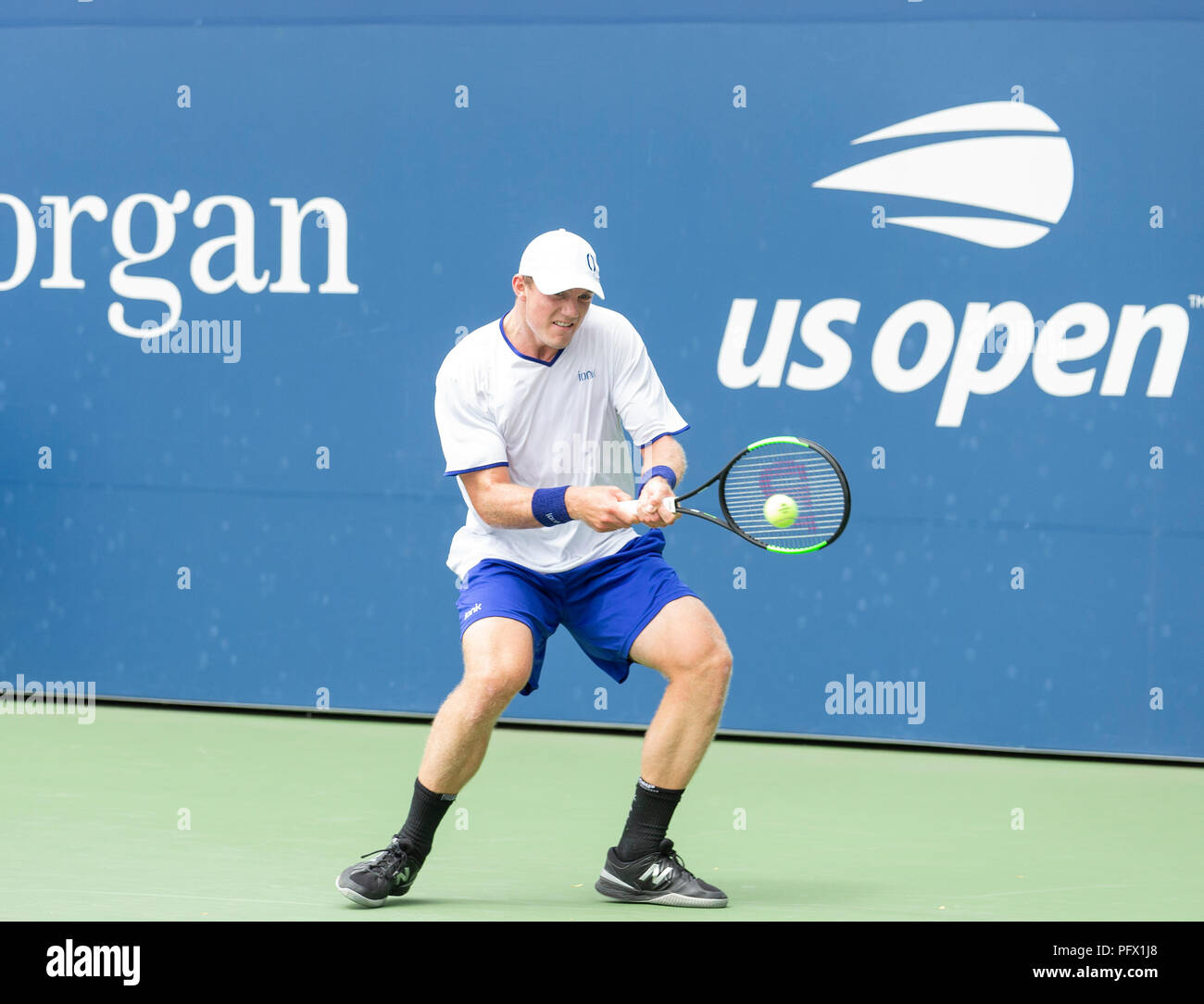 New York, United States. 21st Aug, 2018. Tom Fawcett of USA returns ball  during qualifying day 1 against Alexey Vatutin of Russia at US Open Tennis  championship at USTA Billie Jean King