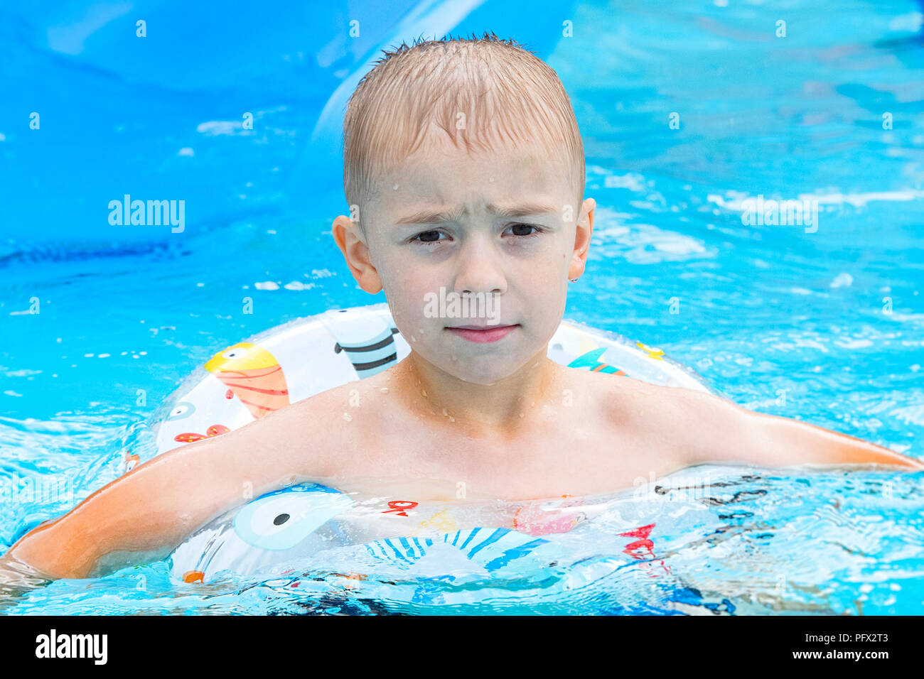 Boy on amusement park ride hi-res stock photography and images - Alamy