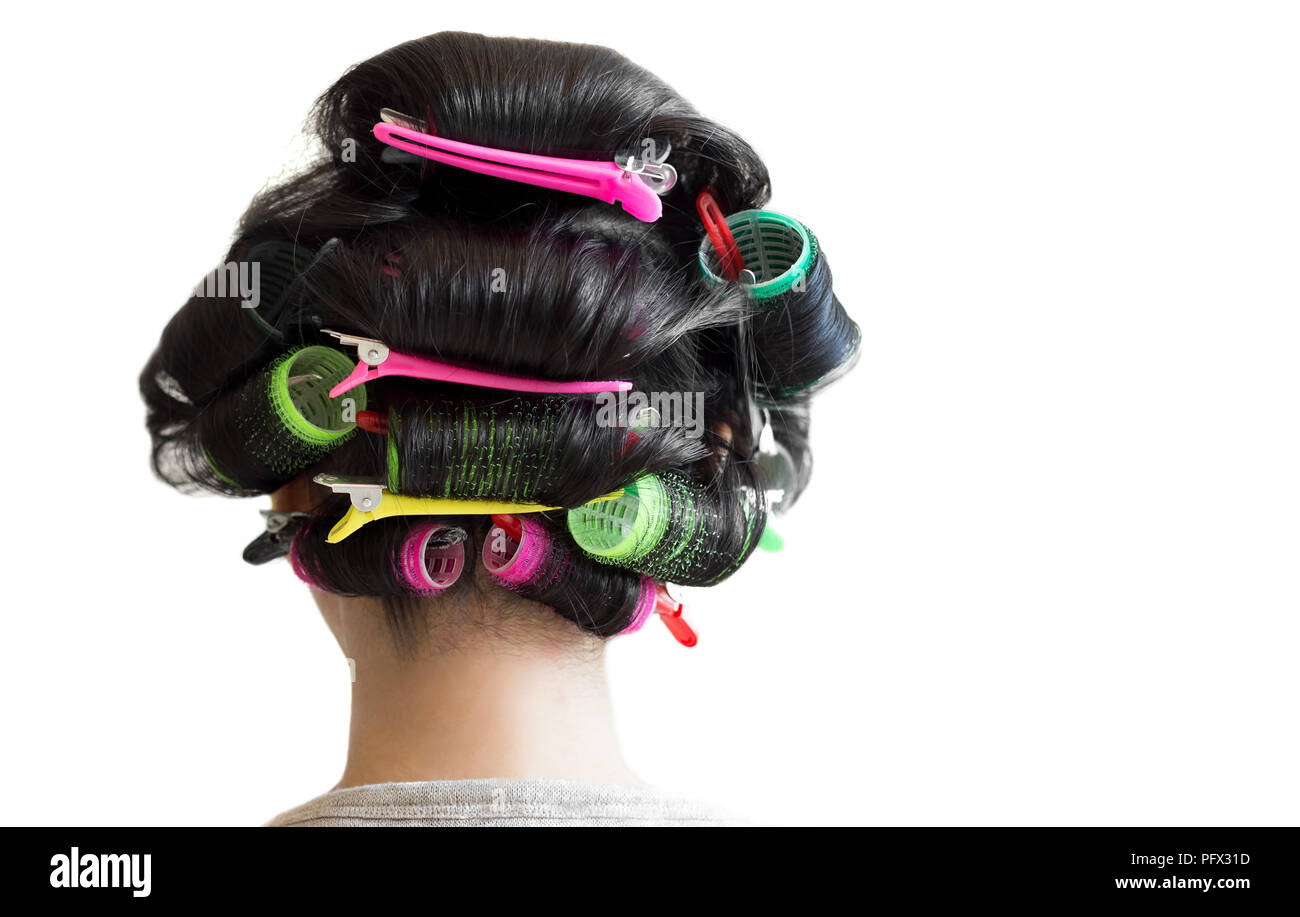 Young woman rollers in hair hires stock photography and images Alamy