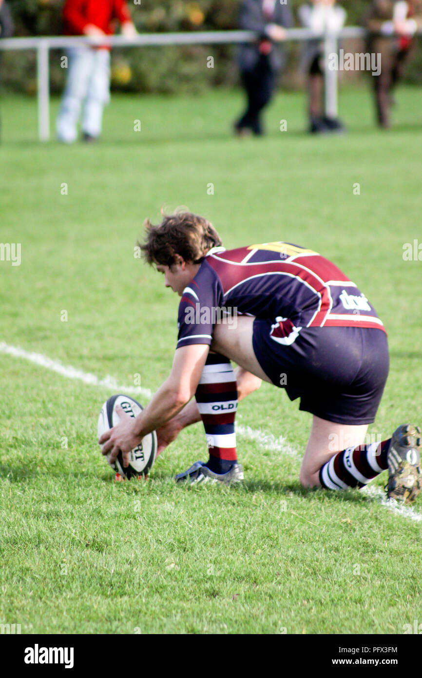 Flyhalf preparing to take a penalty in a rugby match Stock Photo