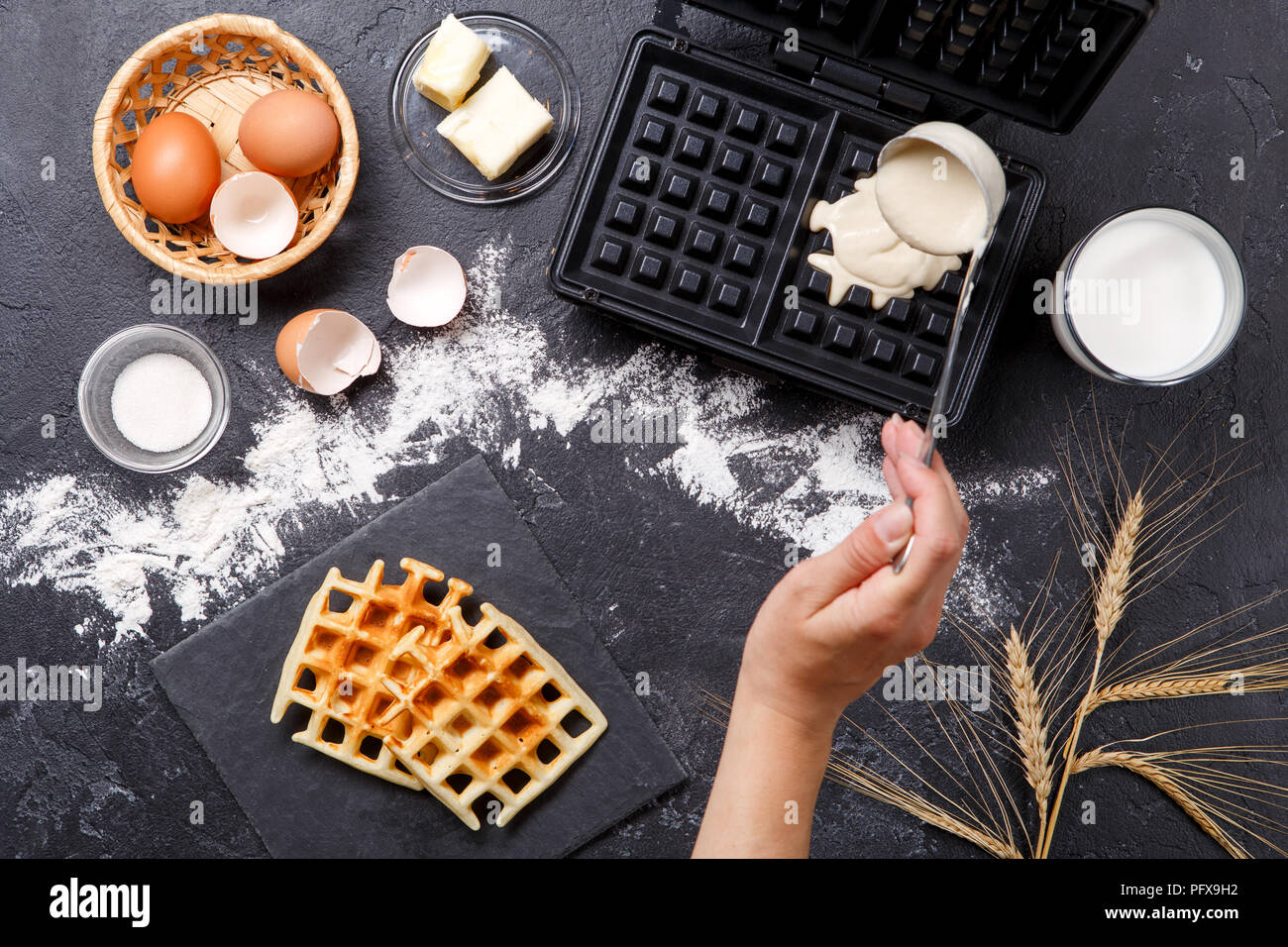 Photo on top of flour, eggs, waffle iron, spikelets, fresh roasted