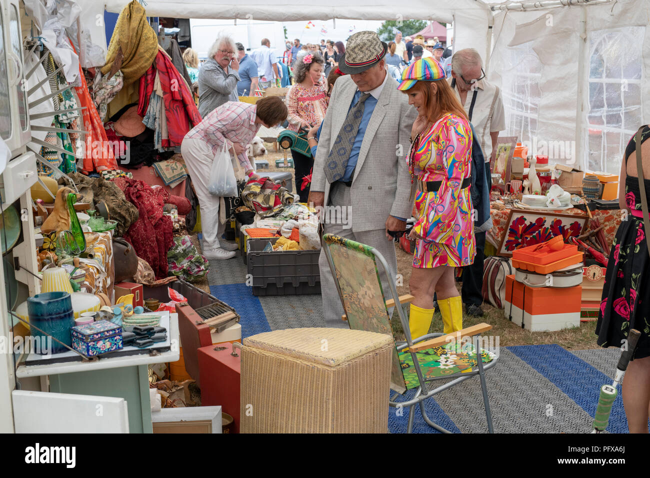 Colourful Vintage stall selling old fashioned household items at a vintage retro festival. UK Stock Photo