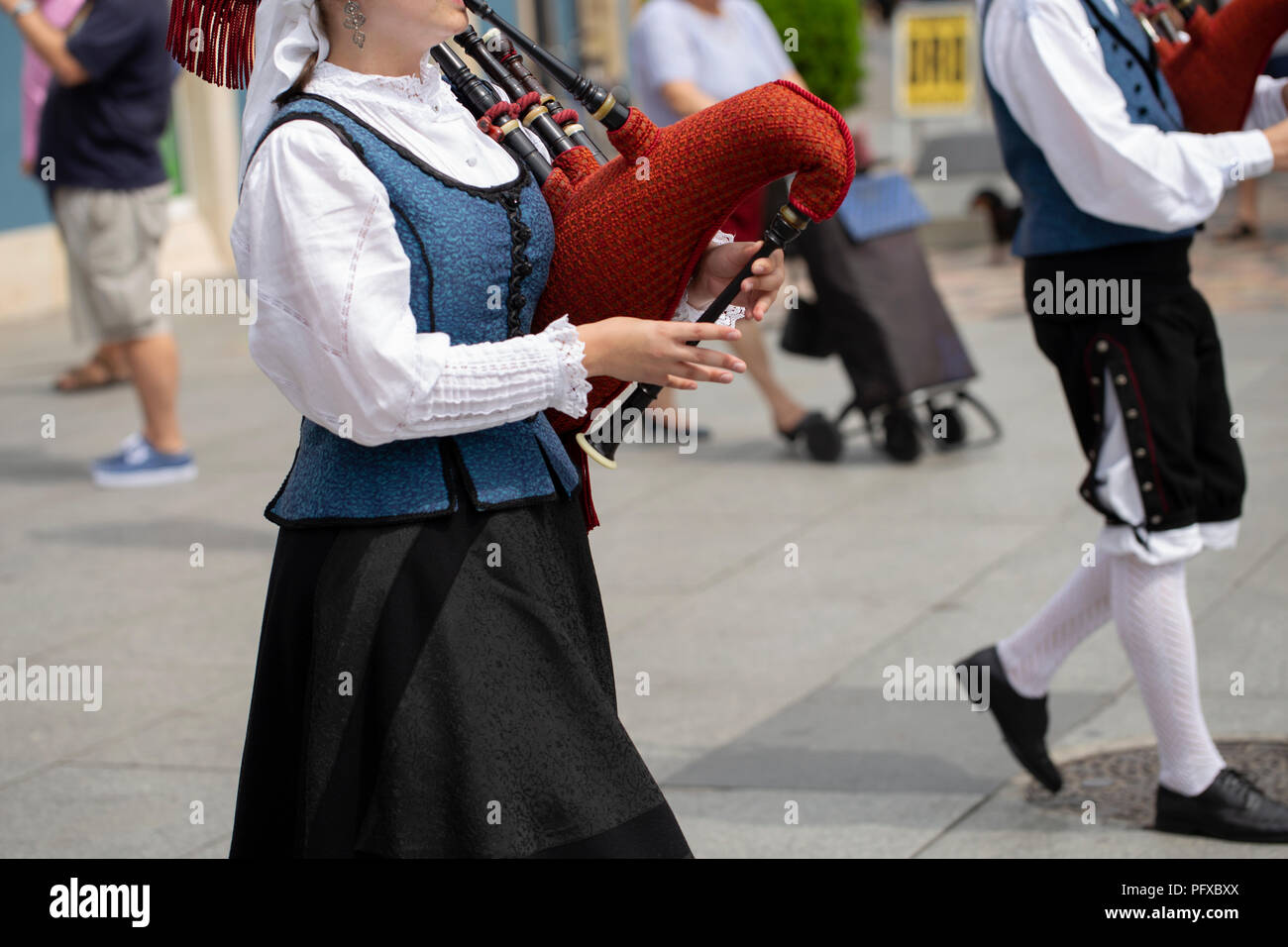 Woman playing bagpipe, spanish traditional dance group Stock Photo