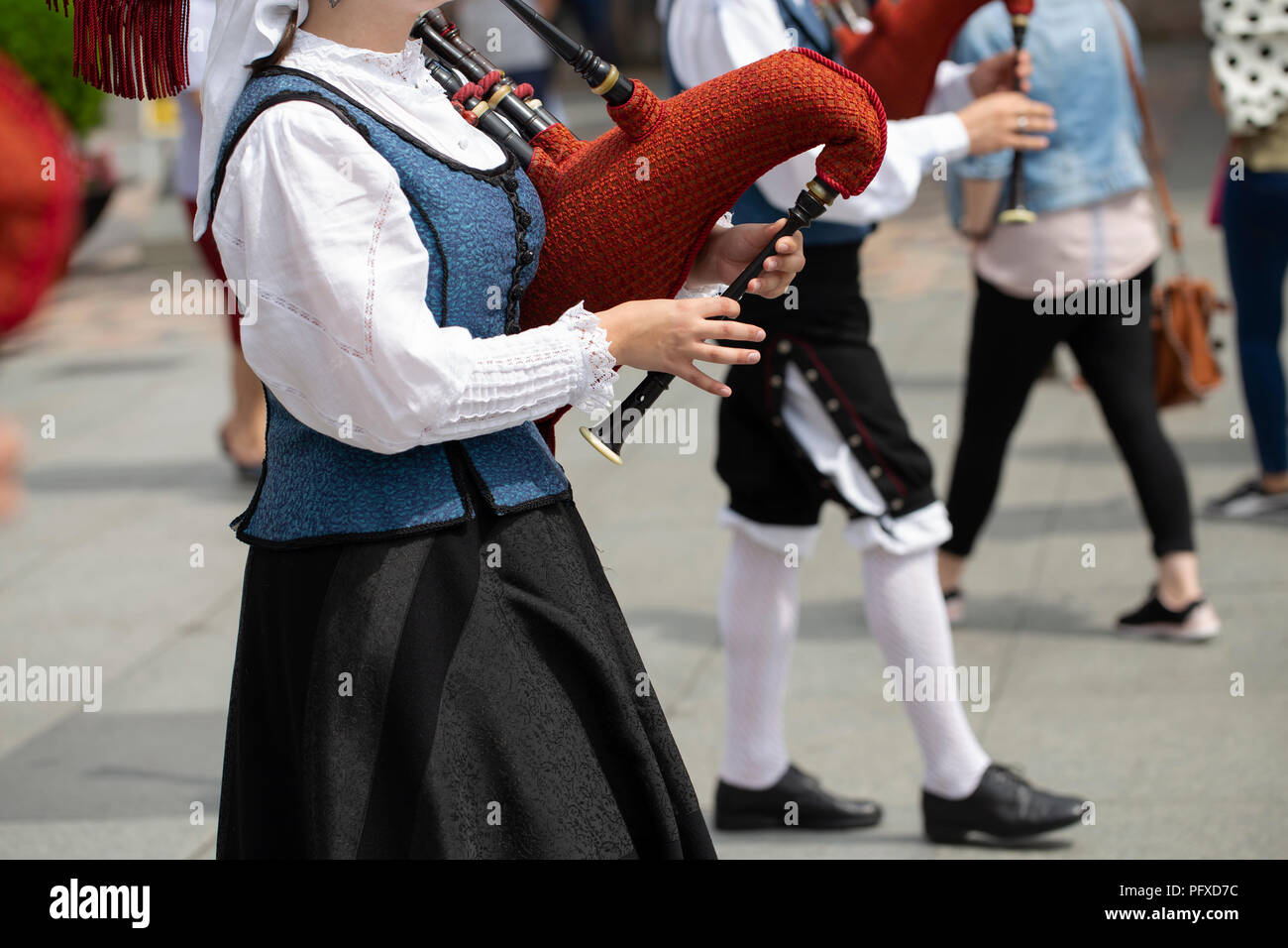 Woman playing bagpipe, spanish traditional dance group Stock Photo