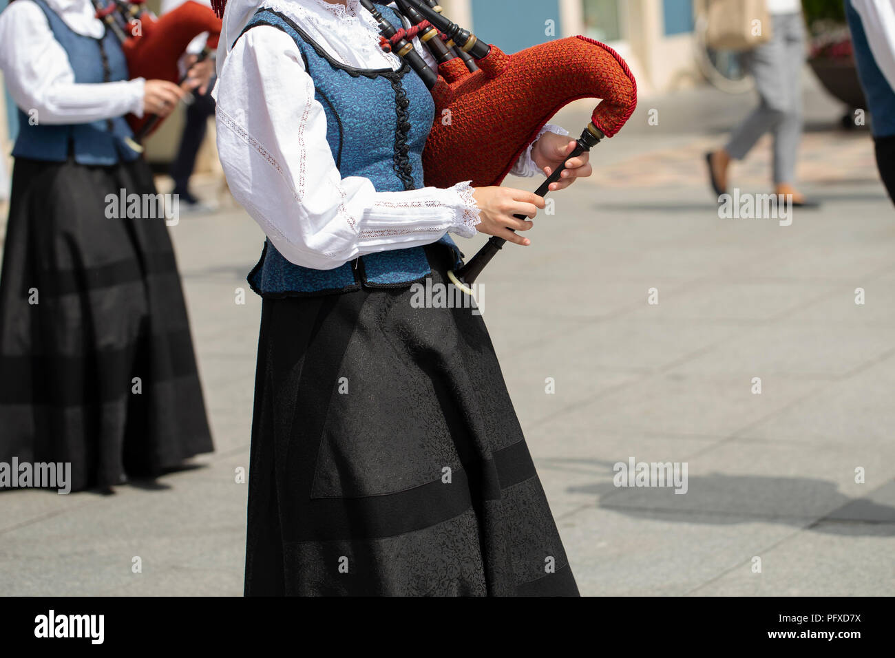 Woman playing bagpipe, spanish traditional dance group Stock Photo