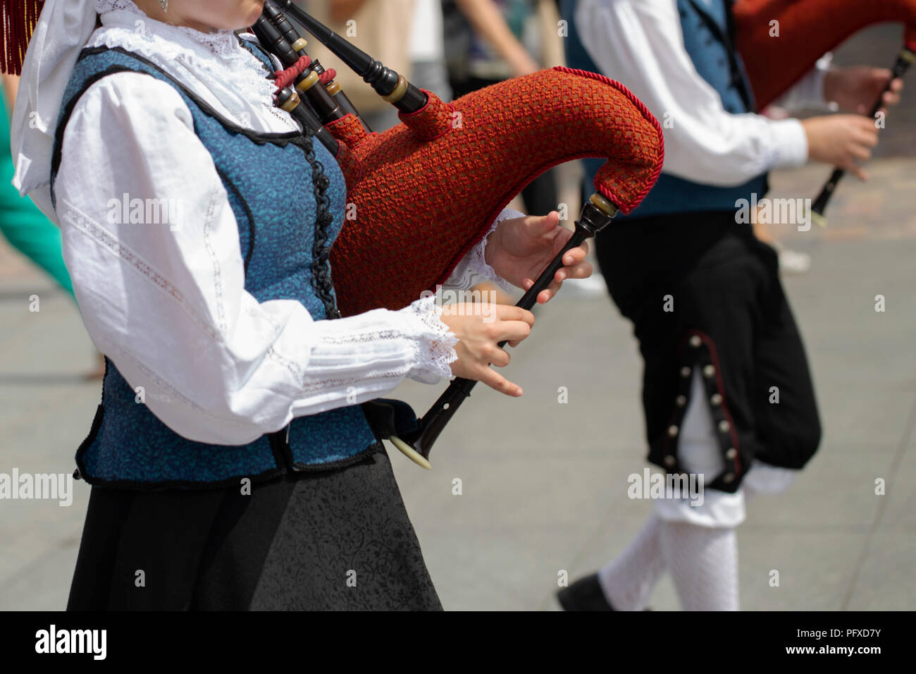 Woman playing bagpipe, spanish traditional dance group Stock Photo