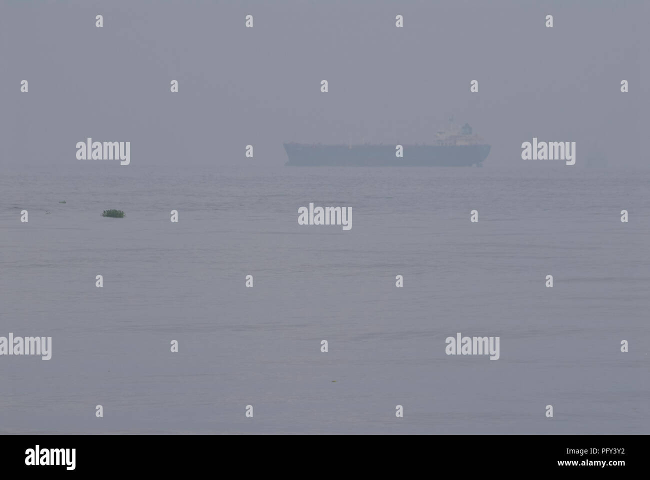 Oil / Chemical tankers at sea during a misty day Stock Photo