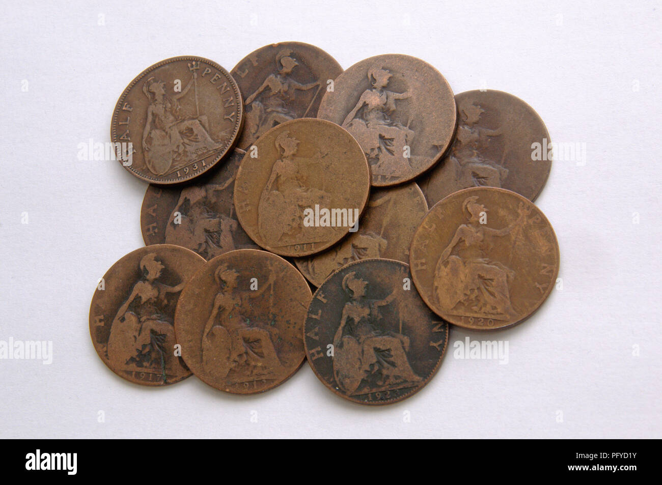 Pile of old British halfpenny coins Stock Photo