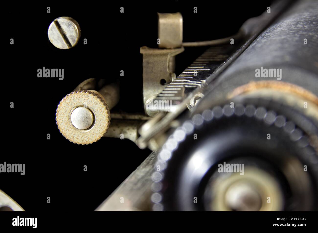 A Relic: An Outer Space Wannabe. Abstract of the gears and screws of a 1923 typewriter that seems to float in the blackness of space. Stock Photo