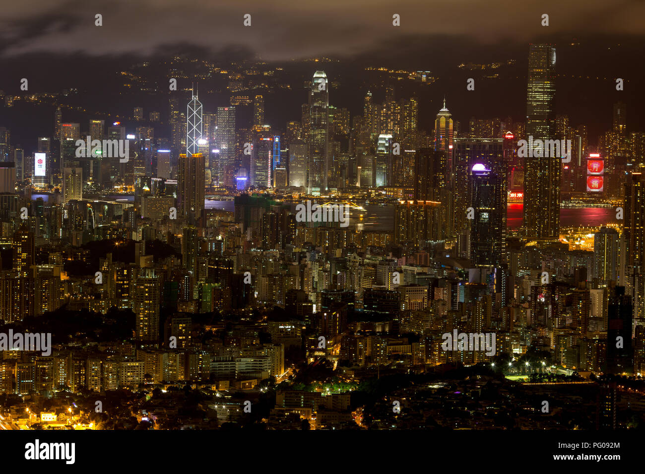 a big asia city by night to the sunrise with all the lights on the streets and skyline Stock Photo