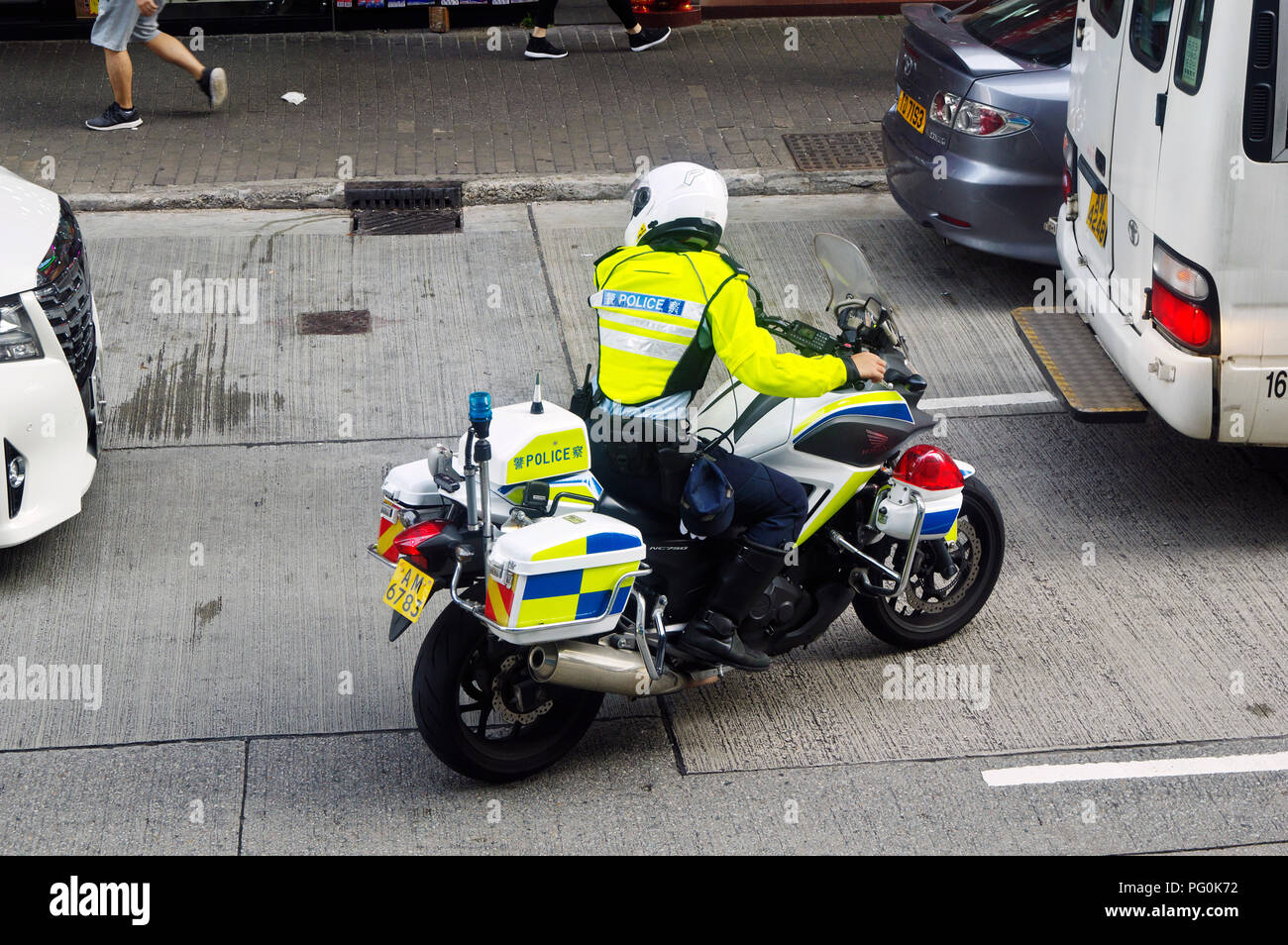 policeman on a motorcycle in the street of hongkong 3.08.2018 Stock Photo