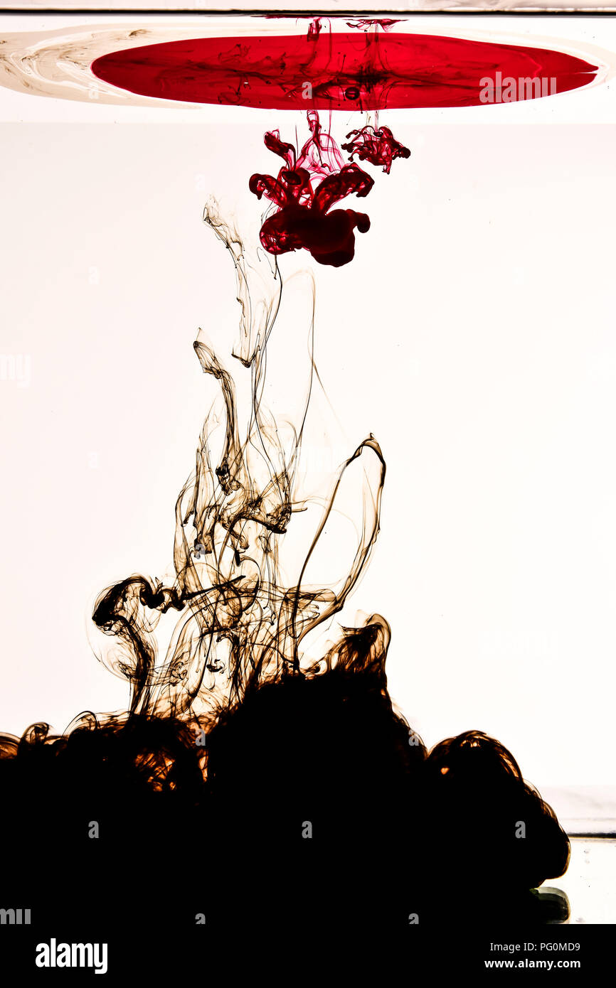 Ink drops in water with white background Stock Photo Alamy