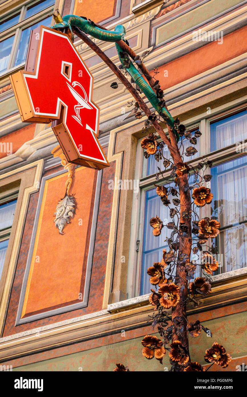 Ornate overhead hanging sign for a restaurant in Fussen in Southern German Stock Photo