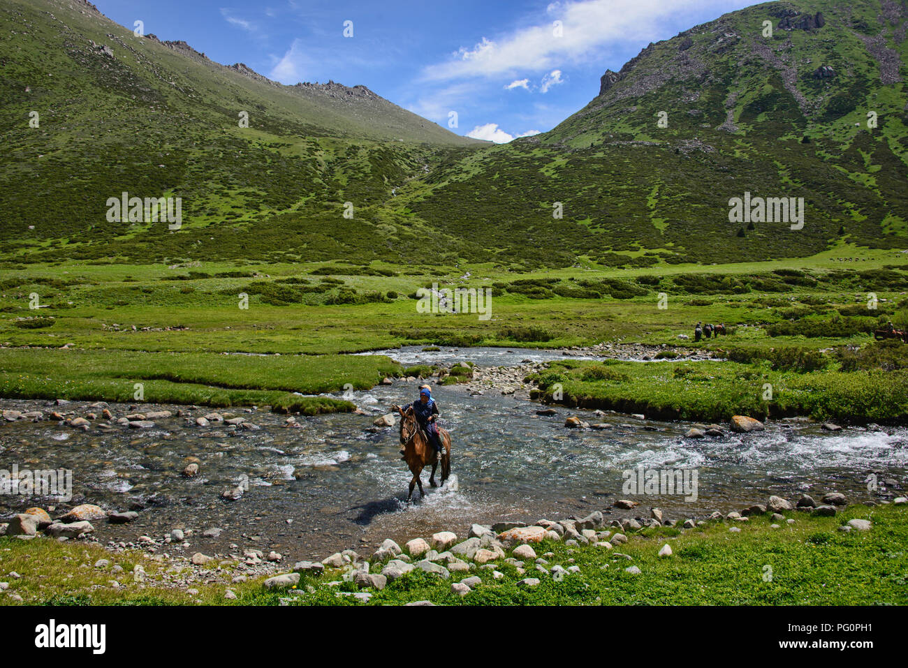 Crossing the Tup River, Jyrgalan Valley, Kyrgyzstan Stock Photo