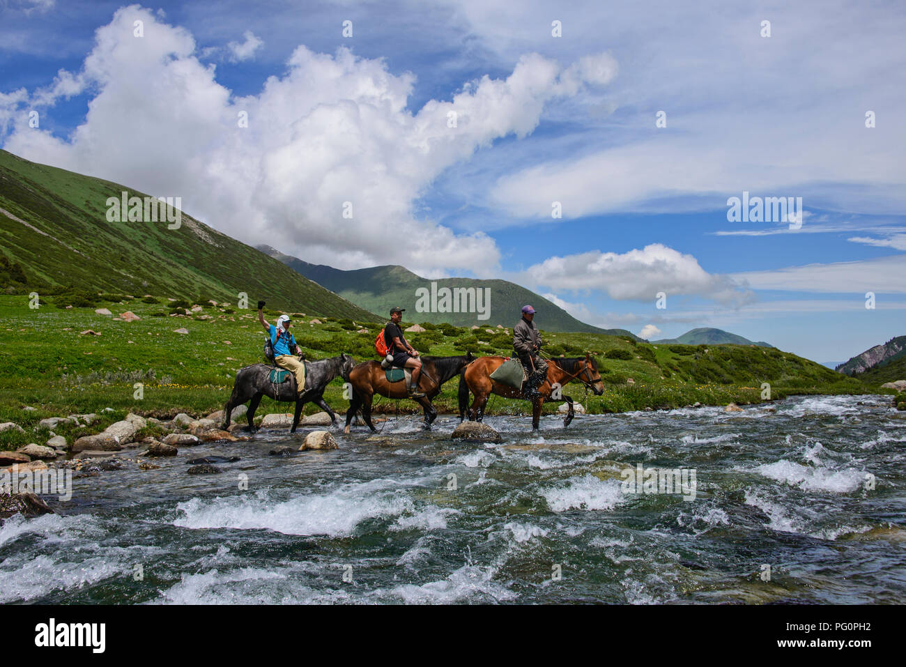 Crossing the Tup River, Jyrgalan Valley, Kyrgyzstan Stock Photo