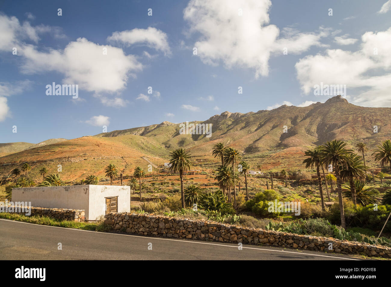 Rural house ad dry landscape hills behind in Fuerteventura, Canary Islands, Spain. Stock Photo