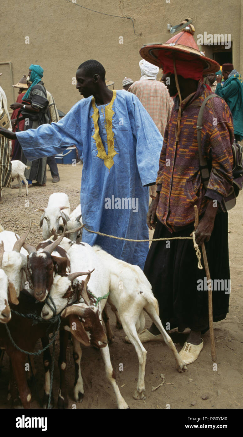 Goats and herdsmen at the Monday market at The Great Mosque in Djenne, Mali                FOR EDITORIAL USE ONLY Stock Photo