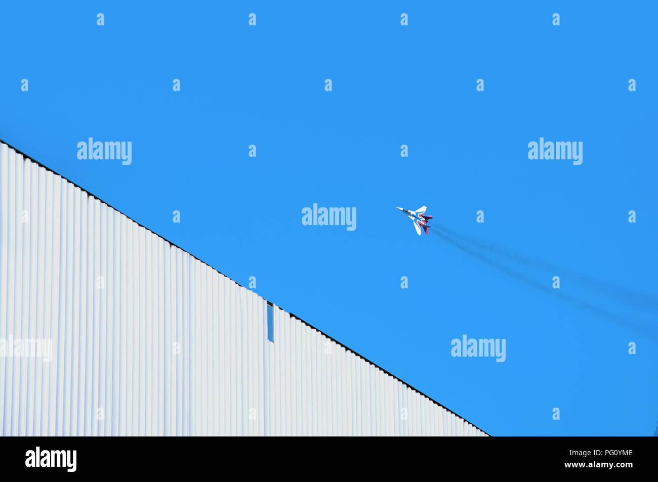 Single small airplane flying diagonal on the minimalist background of clear blue sky Stock Photo - Alamy Single small airplane flying diagonal on the minimalist background of clear blue sky Stock Photo - Alamy