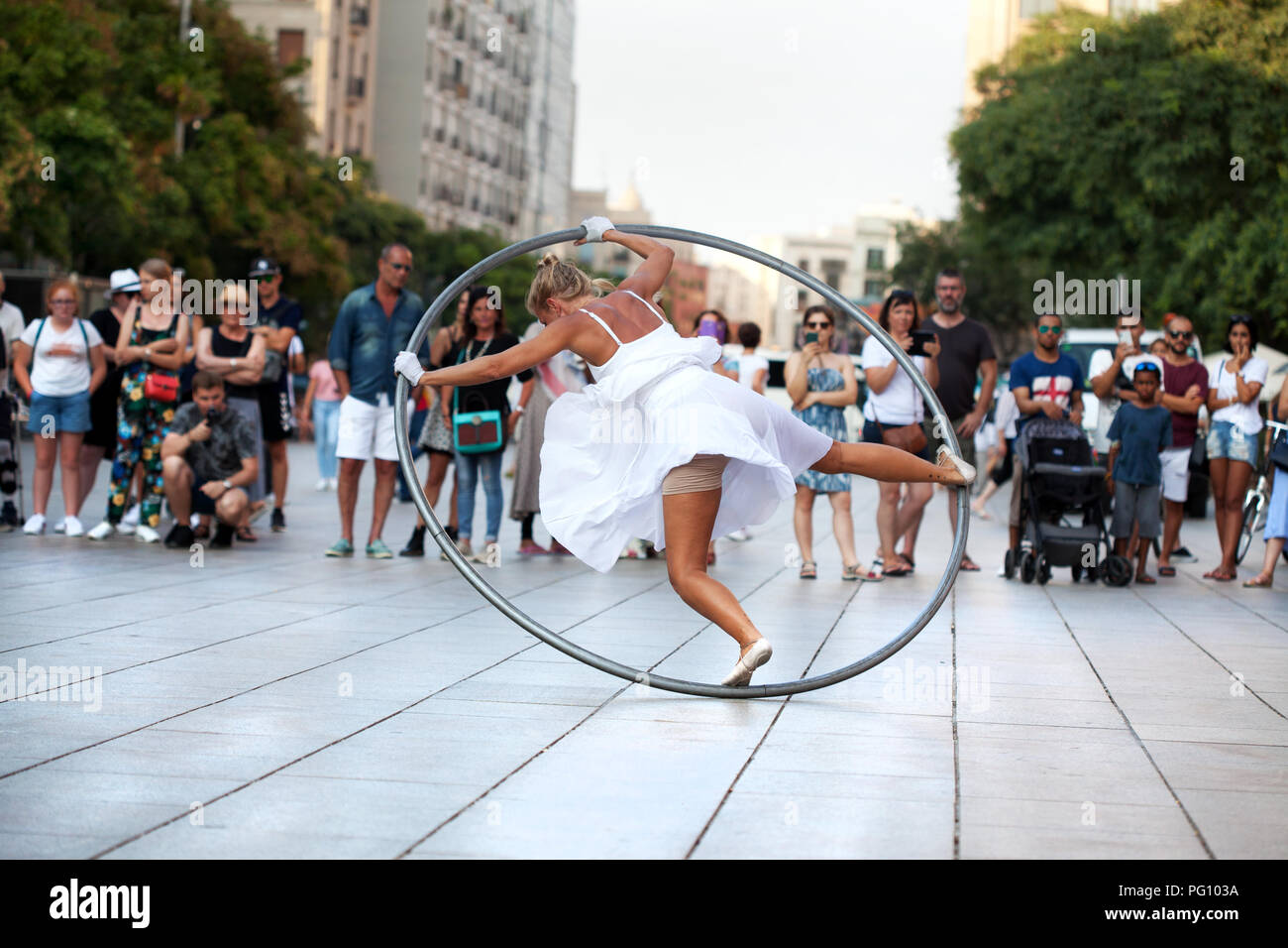 Woman performing with Cyr wheel, Barcelona. Stock Photo
