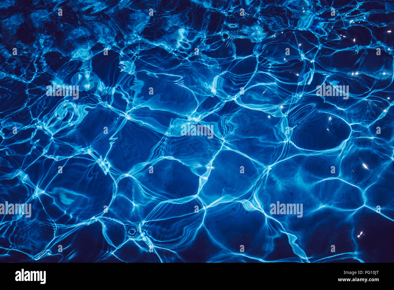 Blue ripped water in swimming pool hi-res stock photography and images ...