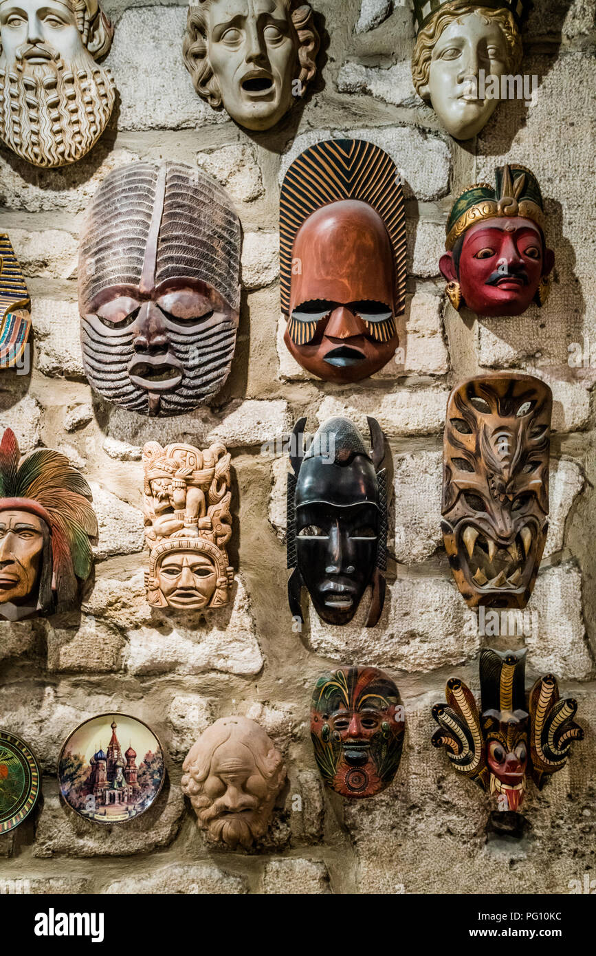 masks hanging on wall. Collection of  masks Stock Photo
