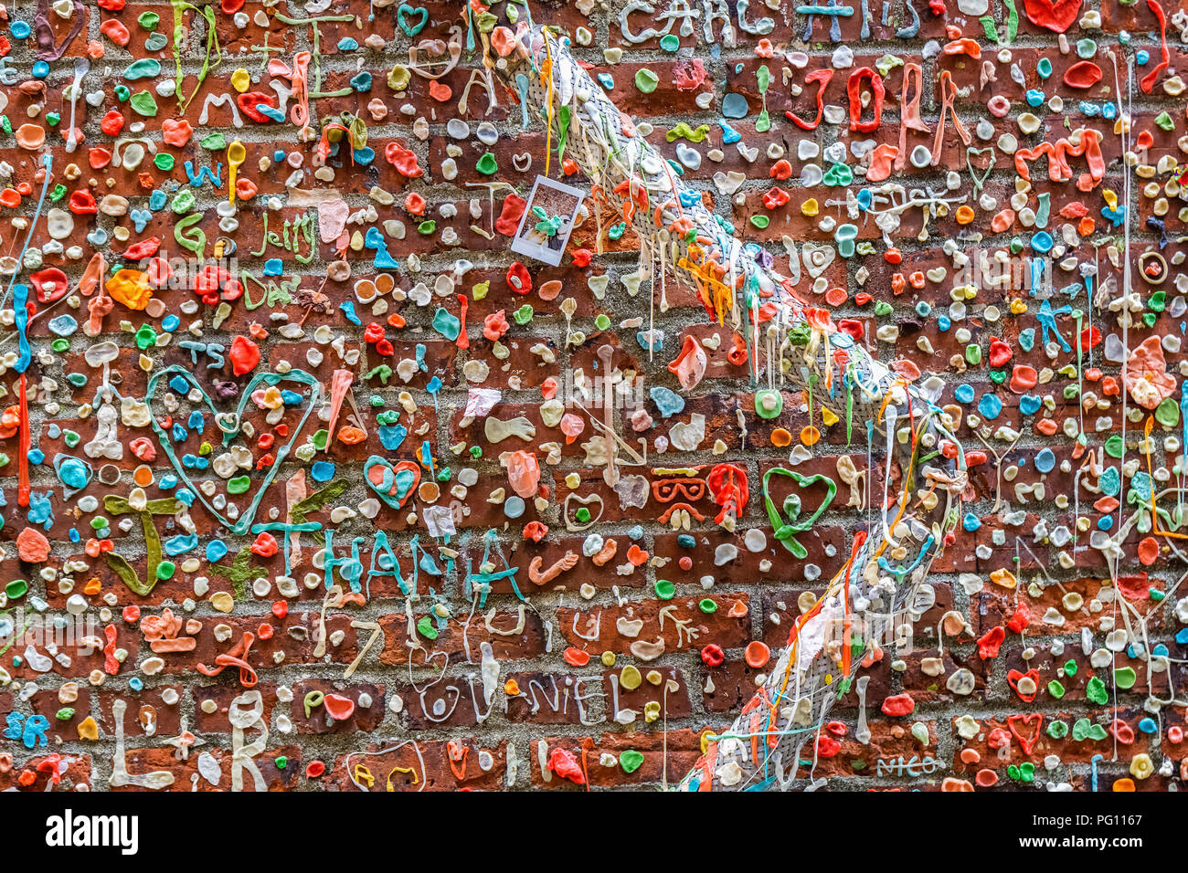 The Gum Wall in Post Alley, near Pike Place Market, living artwork landmark in downtown Seattle, Washington state, USA. Stock Photo