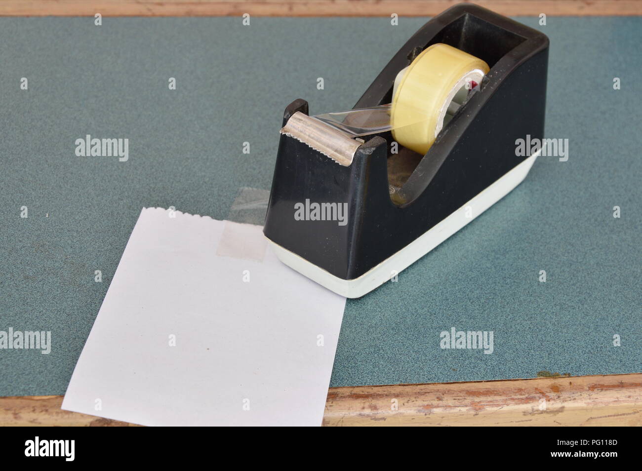 tape dispenser and paper note on counter cashier in shop Stock Photo