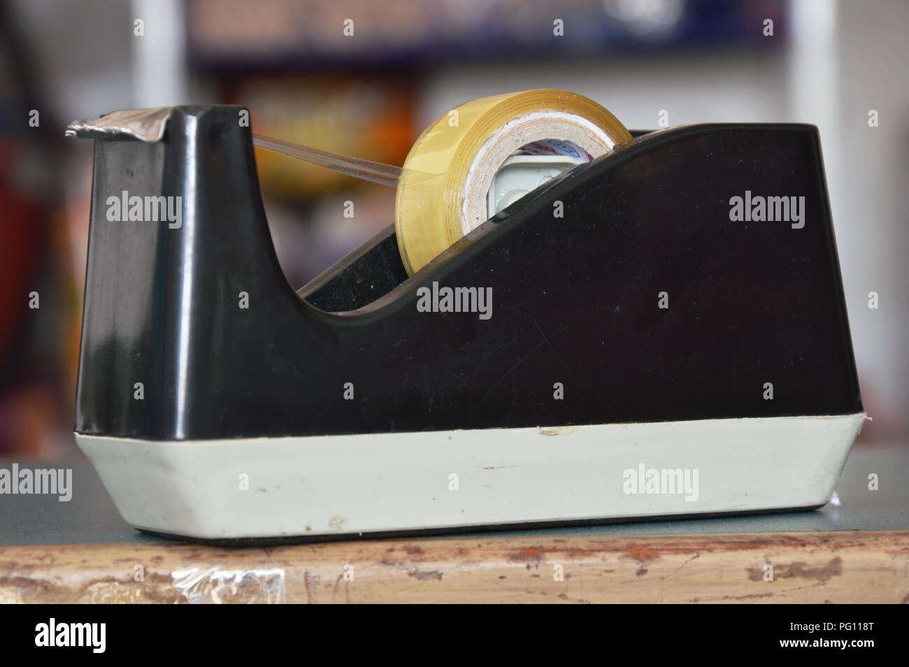 tape dispenser and paper note on counter cashier in shop Stock Photo