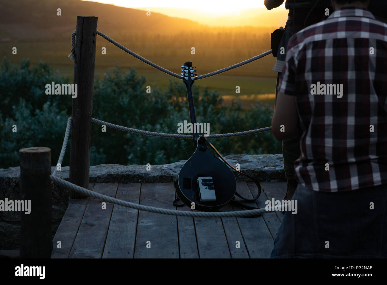 Stringed instrument leaning against ropes against a backdrop of a ...