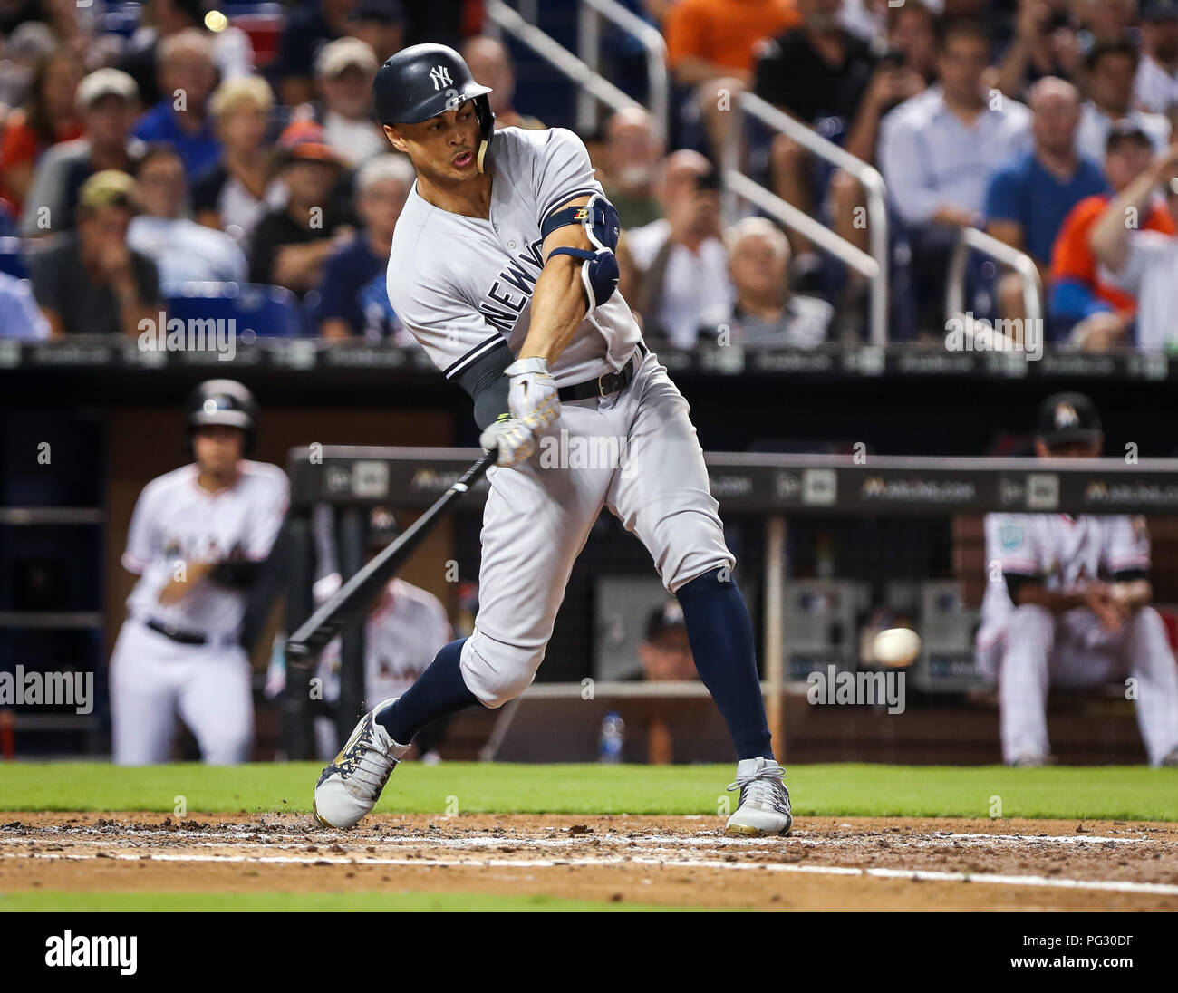 MIAMI, FL - AUGUST 22: New York Yankees left fielder Giancarlo Stanton (27)  runs out to right field during the fourth inning in a game between the  Miami Marlins and the New