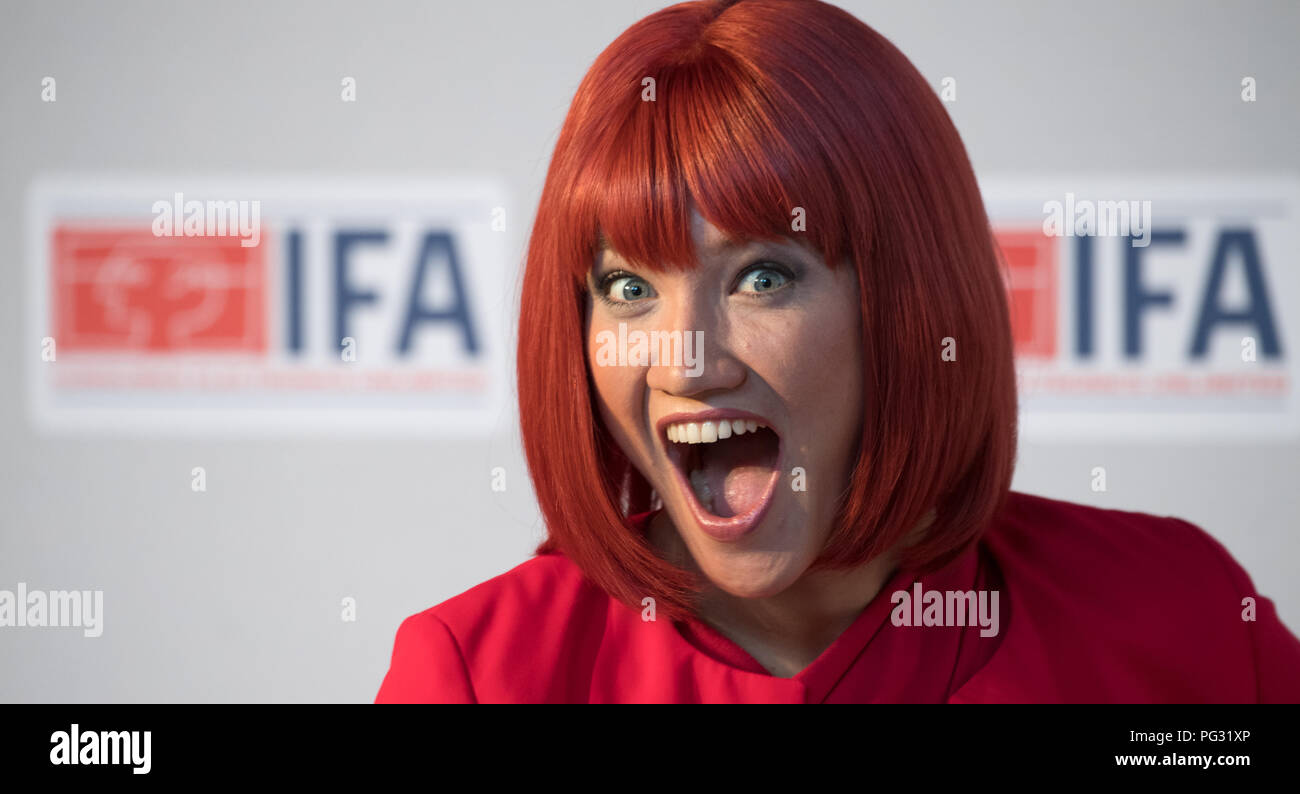 Berlin, Germany. 23rd Aug, 2018. Miss IFA is about to hold the IFA kick-off press conference for the photographers Model. The Consumer Electronics Fair will take place from August 31 to September 5 at the Berlin Exhibition Grounds. Credit: Ralf Hirschberger/dpa/Alamy Live News Stock Photo