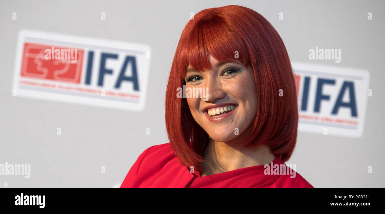 Berlin, Germany. 23rd Aug, 2018. Miss IFA is about to hold the IFA kick-off press conference for the photographers Model. The Consumer Electronics Fair will take place from August 31 to September 5 at the Berlin Exhibition Grounds. Credit: Ralf Hirschberger/dpa/Alamy Live News Stock Photo