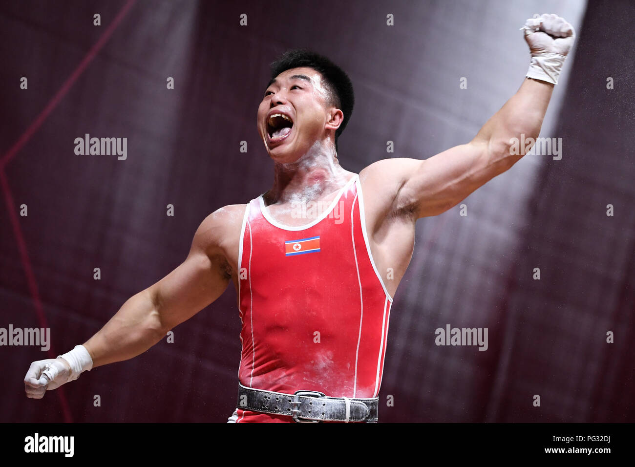 Jakarta, Indonesia. 23rd Aug, 2018. Choe Jon Wi of the Democratic People's  Republic of Korea reacts during men's weightlifting 77kg at the 18th Asian  Games in Jakarta, Indonesia, Aug. 23, 2018. Credit: