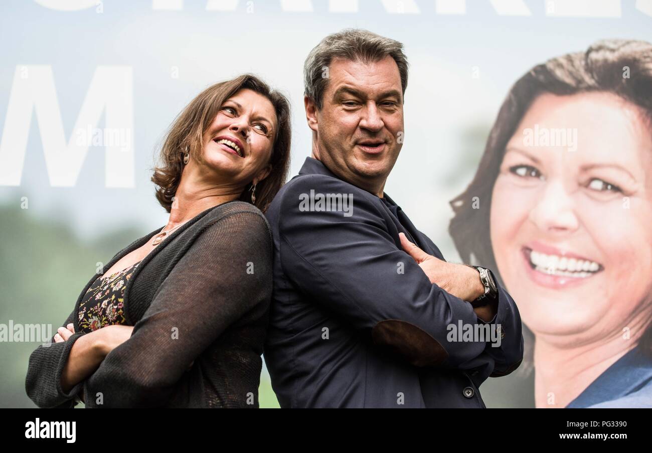 Munich, Bavaria, Germany. 23rd Aug, 2018. ILSA AIGNER, state minister and  MARKUS SOEDER, Minister President of Bavaria, pose in front of their joint  election campaign poster. The Bavarian CSU party revealed today