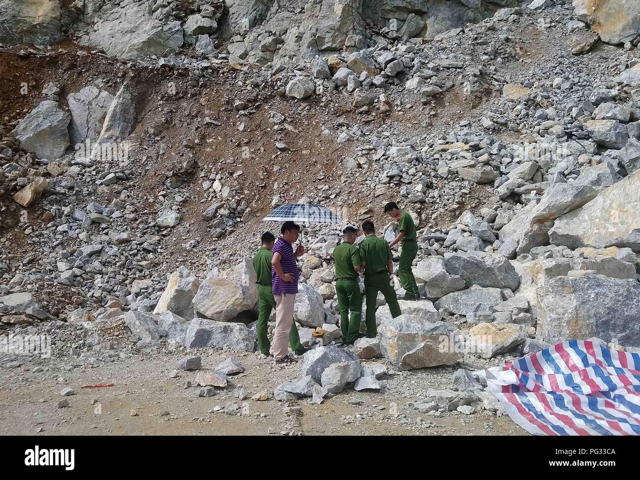 Cao Bang, Vietnam. 23rd Aug, 2018. Local police investigate the explosion site in Vietnam's northern Cao Bang province, on Aug. 23, 2018. Three workers were killed and another one injured in an explosion when they were preparing dynamite for the repair of a provincial road in Vietnam's northern Cao Bang province, Vietnam News Agency reported on Thursday. Credit: VNA) (dtf/Xinhua/Alamy Live News Stock Photo