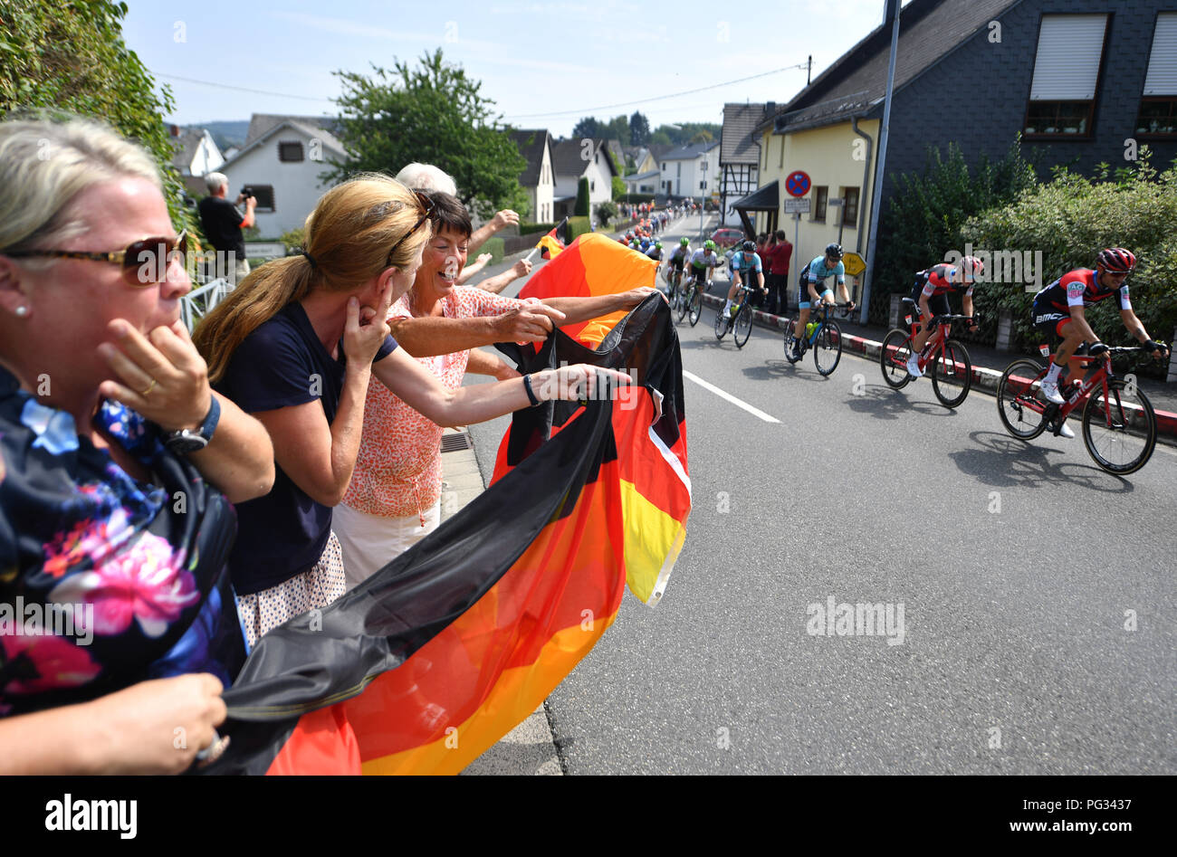 Koblenz, Germany. 23rd Aug, 2018. Cycling, UCI European series, Germany Tour, Koblenz - Bonn (157, 00 km), Stage 1. Damiano Caruso (r) from Italy of the BMC Racing Team passes fans in Helferskirchen. Credit: Bernd Thissen/dpa/Alamy Live News Stock Photo