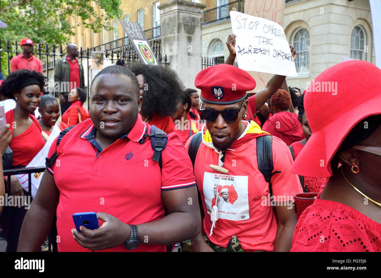 London, 23rd August 2018. Campaigers protest in Whitehall opposite Downing Street against Ugandan President Museveni and in support of Bobi Wine (Robert Kyagulanyi Ssentamu, also known as Bobi Wine, Ugandan politician, musician and actor) who was rearrested in Uganda on charges of treason, moments after the state had withdrawn previous charges of illegal possession of firearms and ammunition. Credit: PjrFoto/Alamy Live News Stock Photo