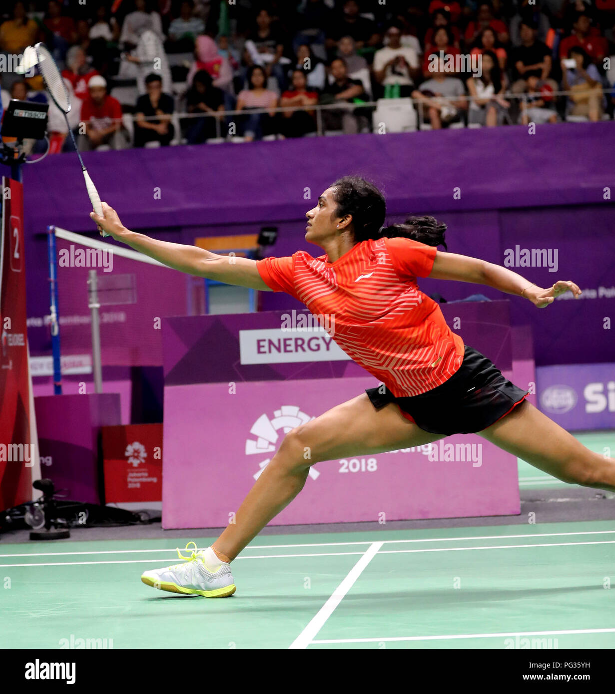 Jakarta, Indonesia, 23rd Aug 2018 Badminton Indias Star Shuttler PV Sindhu in action who snatched victory from the jaws of defeat against Vietnams Thi Trang Vu 21-10, 12-21, 23-21 in a womens