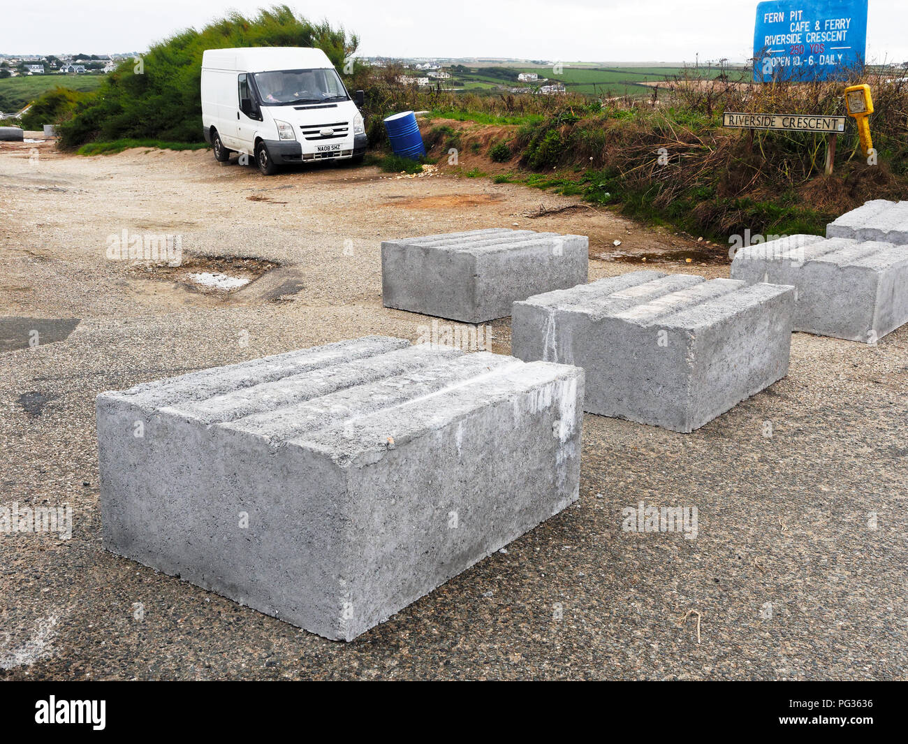 Newquay, Cornwall, UK. 23 August, 2018. Unknown Cornish Vigilantes trap a Camper Van with Concrete blocks at  Pentire Head Newquay beauty spot. The Vigilantes claim they are tired of long stay wild campers on a section of the unadopted road and have  taken  direct  action by sealing a section of the road against access with concrete blocks. Lack of official action over the years  prompted the action. Both Police and Cornwall Council  say their hands are tied on any action in response as this is private ground. Local opinion is divided.  August,23rd,2018 Credit: Robert Taylor/Alamy Live News Stock Photo