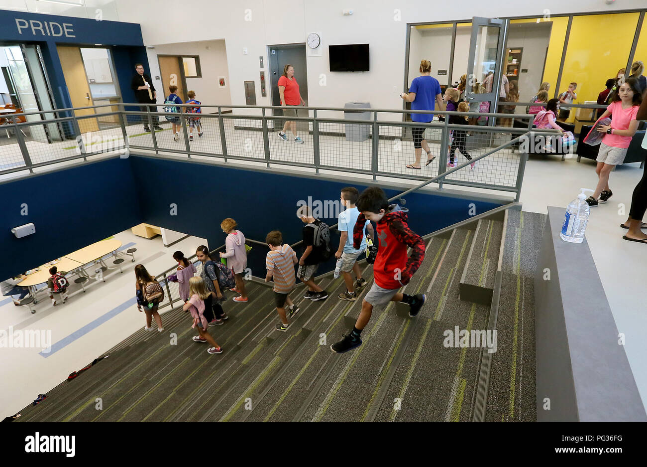 Bettendorf, Iowa, USA. 23rd Aug, 2018. Students race down the stairs towards their classrooms during the first day of classes at Grant Wood Elementary School Thursday, August 23, 2018. Credit: Kevin E. Schmidt/Quad-City Times/Quad-City Times/ZUMA Wire/Alamy Live News Stock Photo