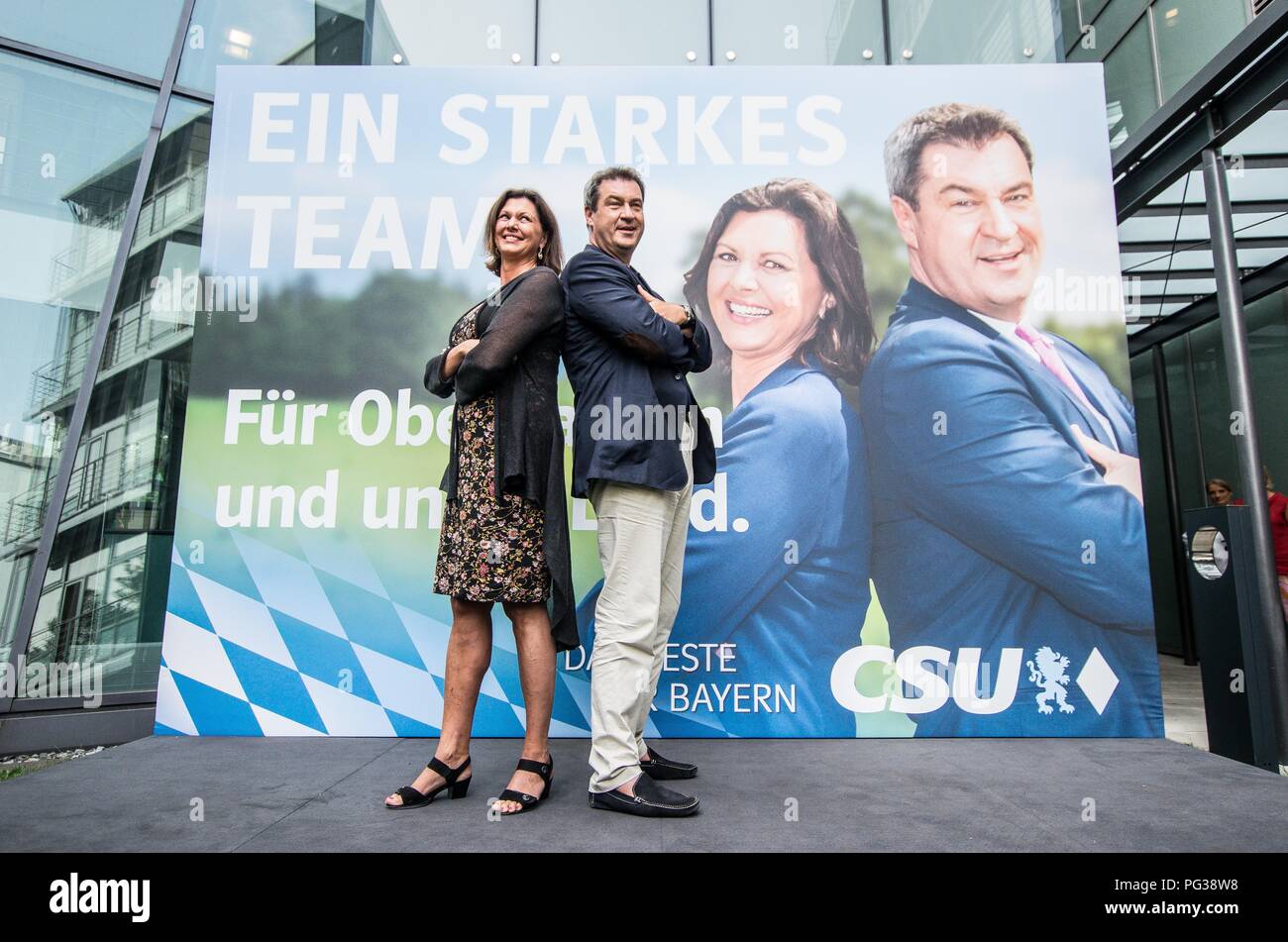 Munich, Bavaria, Germany. 23rd Aug, 2018. ILSA AIGNER, state minister and MARKUS SOEDER, Minister President of Bavaria, pose in front of their joint election campaign poster. The Bavarian CSU party revealed today the first posters and slogans for the October Bavarian Landtagswahl (Parliament Elections). The CSU has countered demanding decency from political opposition. Credit: Sachelle Babbar/ZUMA Wire/Alamy Live News Stock Photo