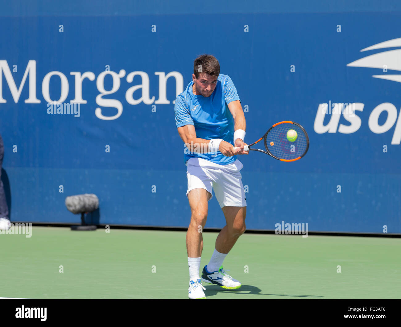 New York, NY - August 23, 2018: Pedro Martinez of Spain returns ball during  qualifying day 3 against Christian Harrison of USA at US Open Tennis  championship at USTA Billie Jean King
