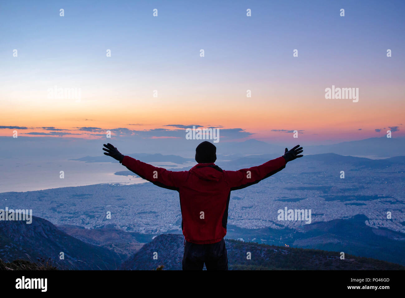 Success! Achieve your dreams, conquer the mountain. Sunset of Athens Greece Stock Photo