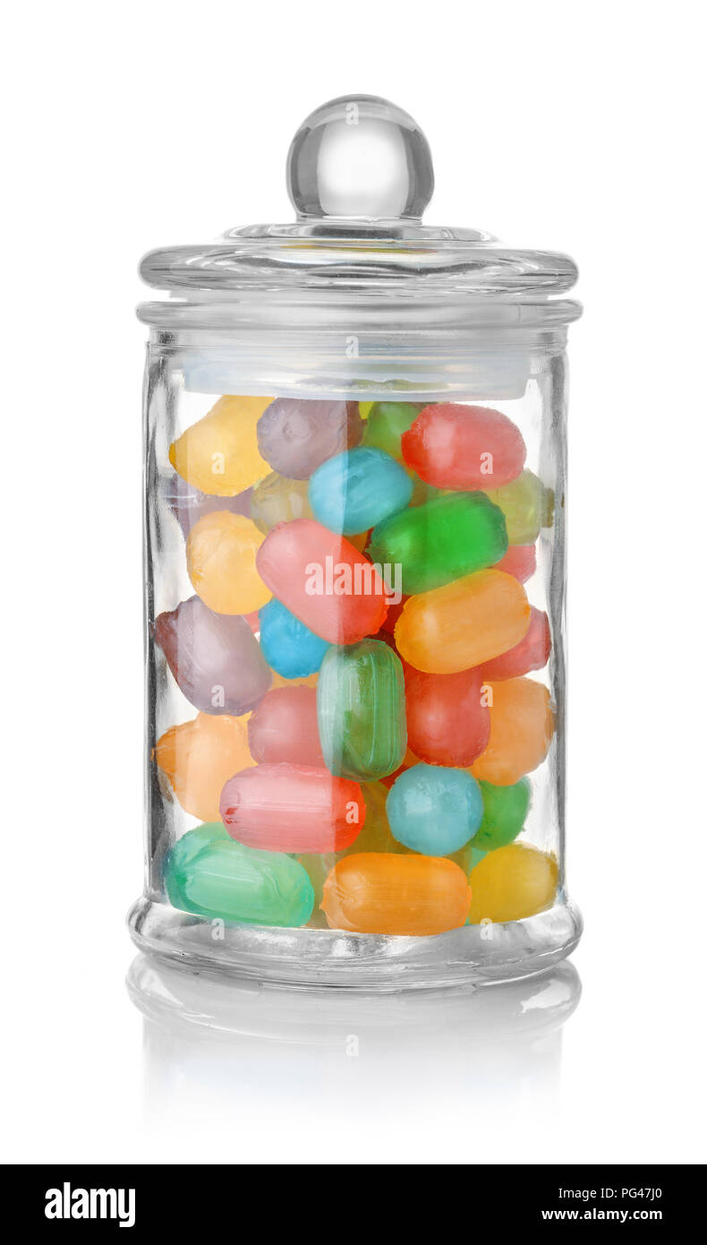 Glass jar full of colorful hard candies isolated on white Stock Photo