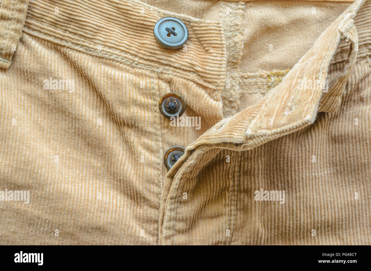 Textile Fabric of Corduroy Pants as Background. Pocket in Pants Closeup. Texture of Beige Velvet Clothes. Stock Photo