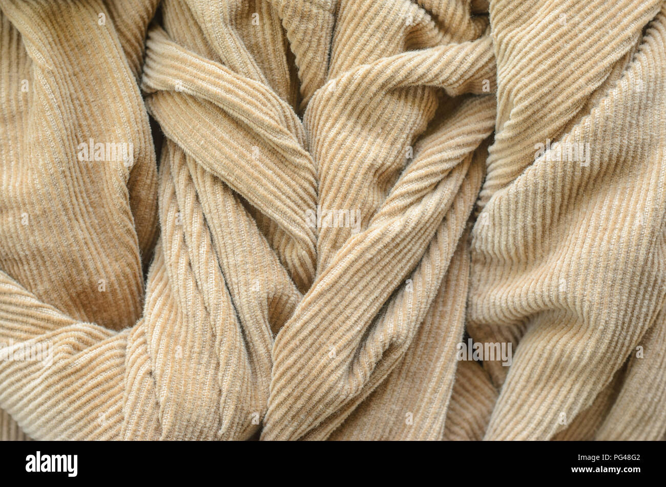 Texture of Soft Velvet Fabric with Folds Closeup. Texture of Beige