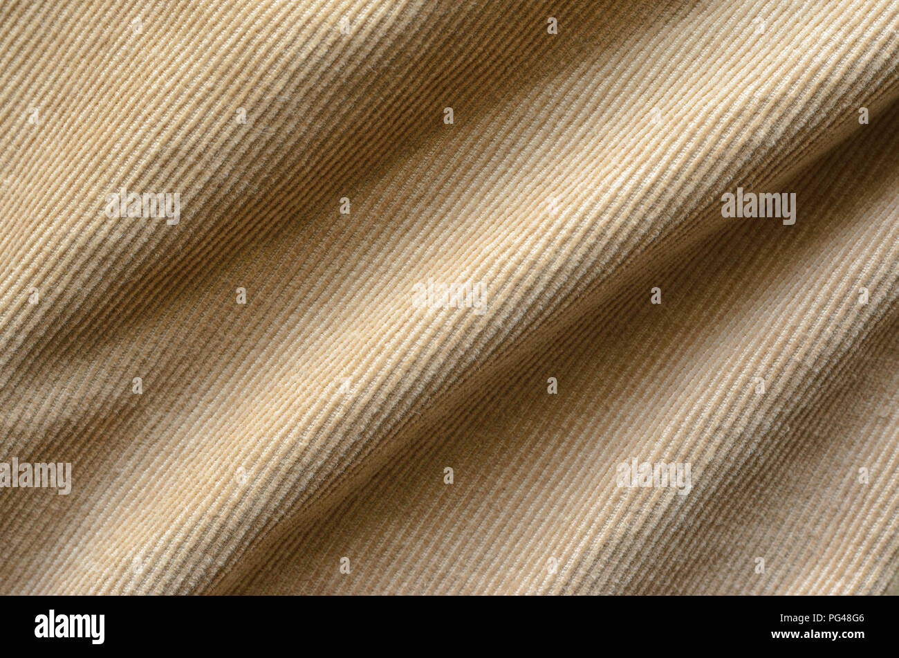 Texture of Soft Velvet Fabric with Folds Closeup. Texture of Beige