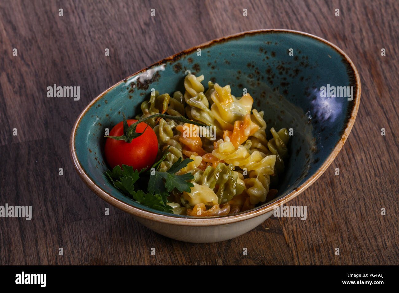 Kids pasta with sauce served tomato Stock Photo - Alamy