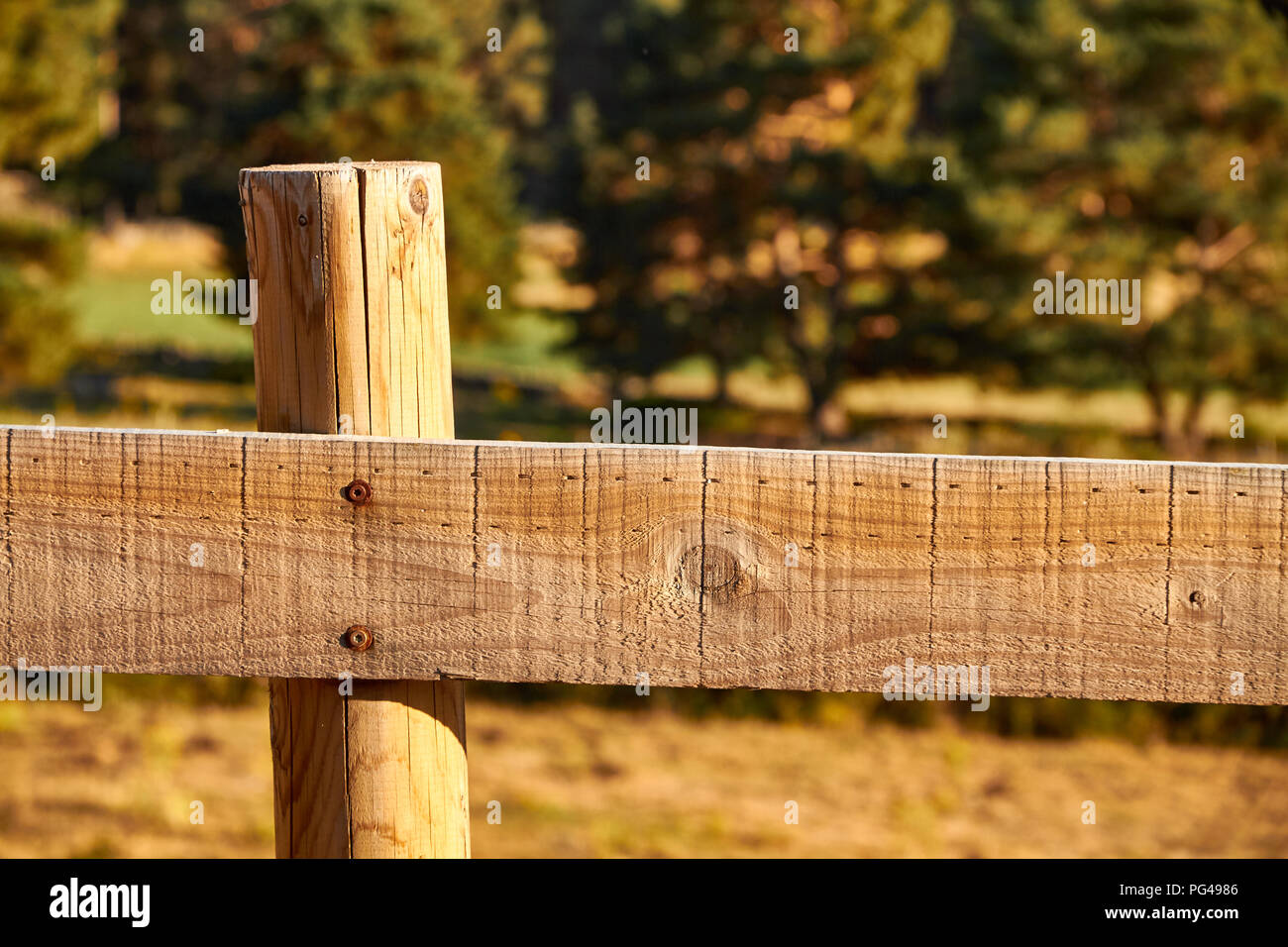 Wood fence on a countryside background Stock Photo - Alamy
